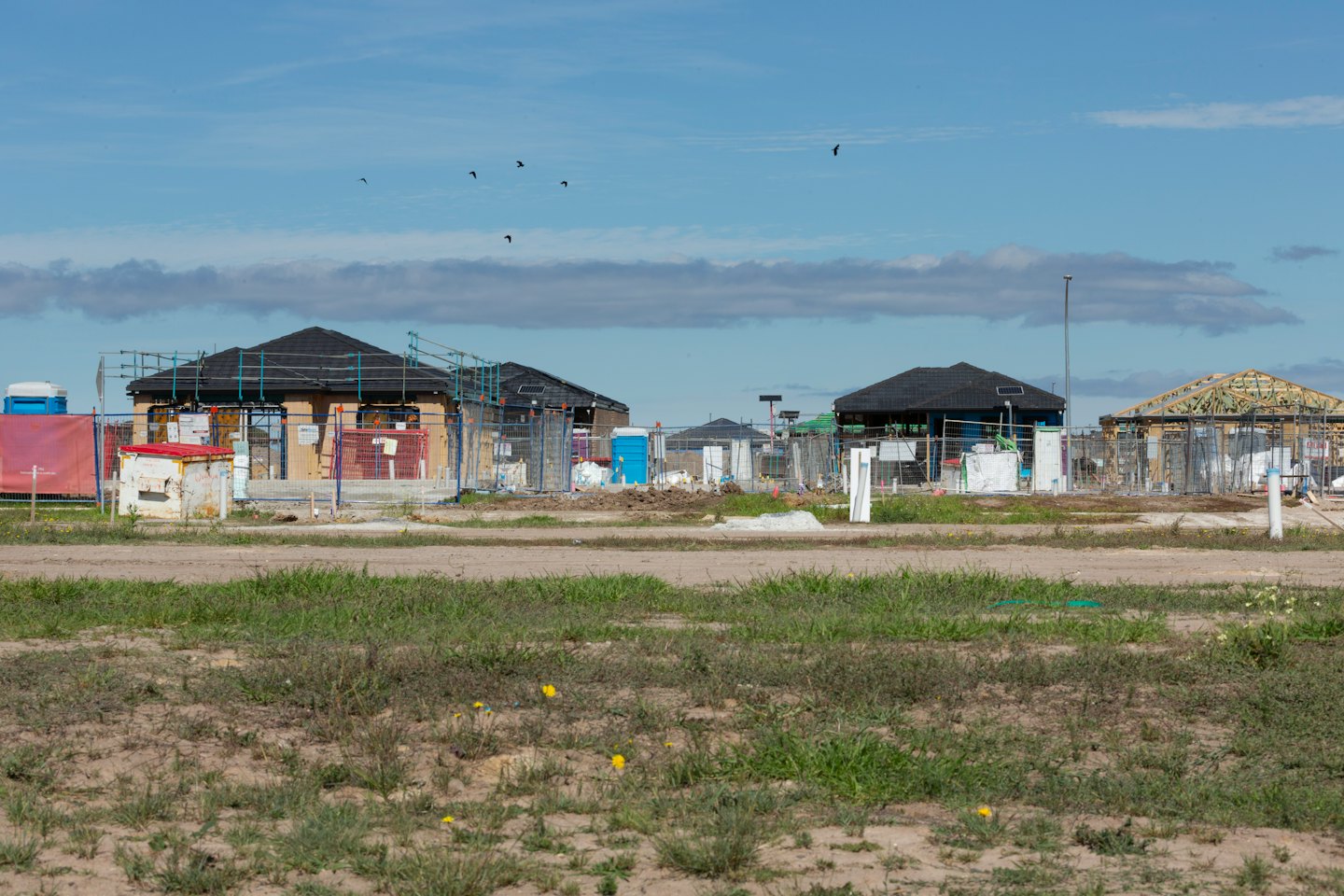 Quote New homes under construction on a sunny day.